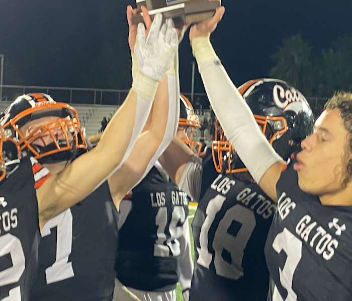 Jaylen Thomas (3), Spencer Burg (18), AJ Minyard (16) and Scott Garwood (7) among those holding up the CCS championship trophy.